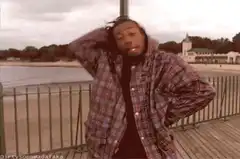 Juice WRLD dancing on a boardwalk