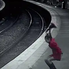 Woman smashes vase on train platform