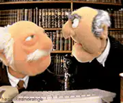 Two old men puppets talking