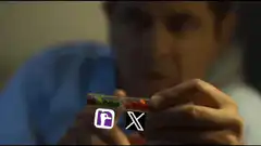 Rowan Atkinson holding a pill with Facebook and X logos