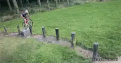 Cyclist jumps over wooden posts