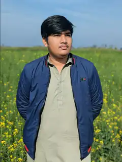 Man standing in yellow flower field