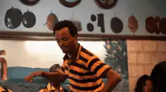 Man in striped shirt dancing