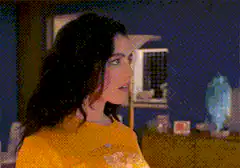 Woman in yellow top and pink bottoms
