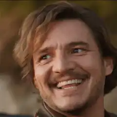 Pedro Pascal smiling and looking up