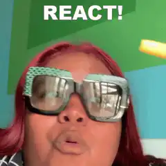 Woman with pink hair and sunglasses reacts