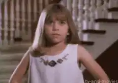 Young girl facepalms in frustration