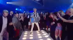 Boy George singing on a light-up runway