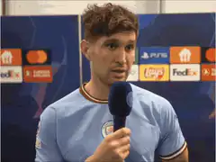 John Stones smiling during interview