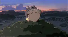 Totoro yawning on a hill