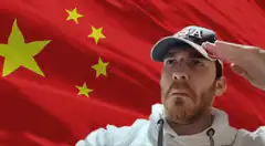 Man saluting in front of Chinese flag