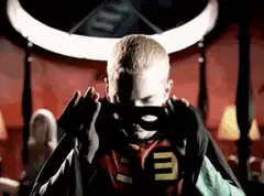 Boy puts on Robin mask