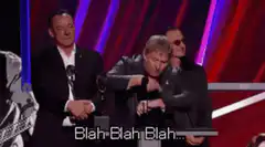 Huey Lewis doing the hip hop hand motion