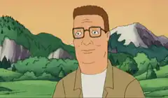 Hank Hill smirking in the mountains