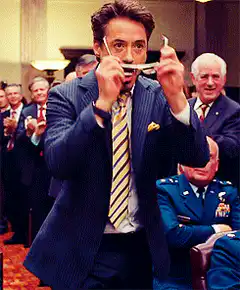 Tony Stark puts on sunglasses