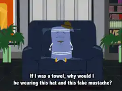 Towel with hat and mustache on couch