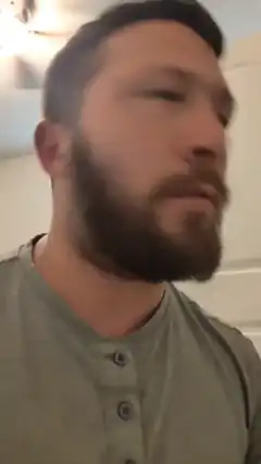 bearded man looking up