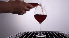 Wine pouring and draining in glass