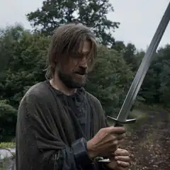 Nikolaj Coster-Waldau holding sword