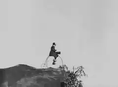 Man on penny-farthing rides off cliff