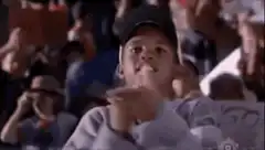 Young boy gives thumbs up