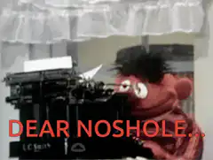 Ernie typing on a typewriter