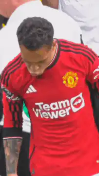 Marcus Rashford looks down then points