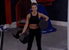 Woman lifting heavy dumbbells