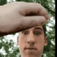 Hand framing a man's head