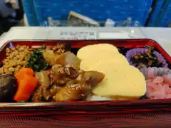 Japanese bento box with tamagoyaki and meat