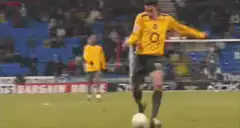 Soccer player misses kick and falls