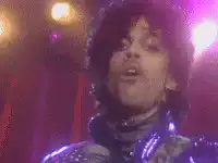 Prince singing and pointing