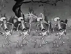Four skeletons dancing in a graveyard