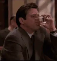 Jim Carrey drinks and spits out liquid