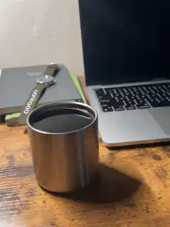 metal cup on desk