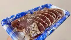 sliced tuna on blue tray