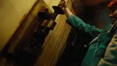 Man turns on old wall switch