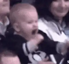 Baby cheering with fist pump