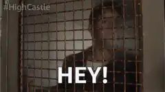 Man behind bars says HEY