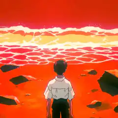 Boy watching red ocean waves