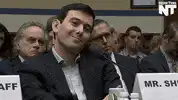 Alex Jones smirking at hearing