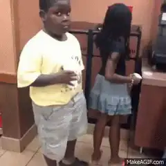 Kid in yellow shirt looks confused