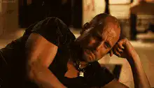 Bald man sniffing money