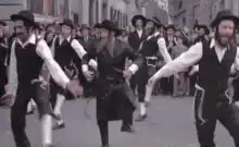 Jewish men dancing in street