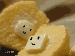 Smiling butter melting on toast