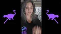 Woman making ok sign with purple birds