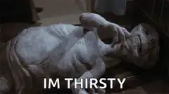 Alien lying down saying im thirsty