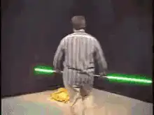 Man with green lightsaber cuts a bagel