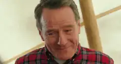 Bryan Cranston shrugging and looking down