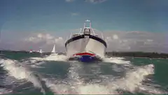 Man jumps out of boat as big ship approaches